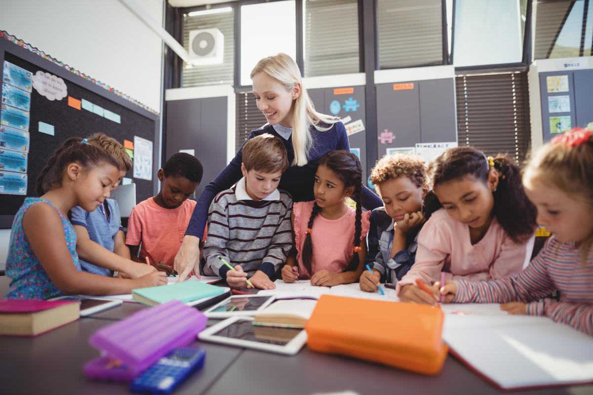Teacher collaborating with children using MTSS